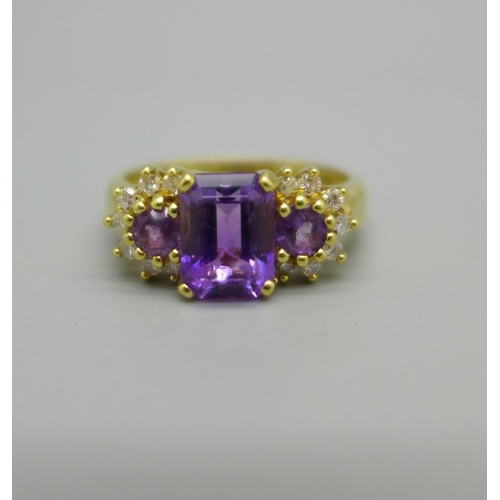 954 - An 18ct gold, amethyst and diamond ring, 4.9g, N