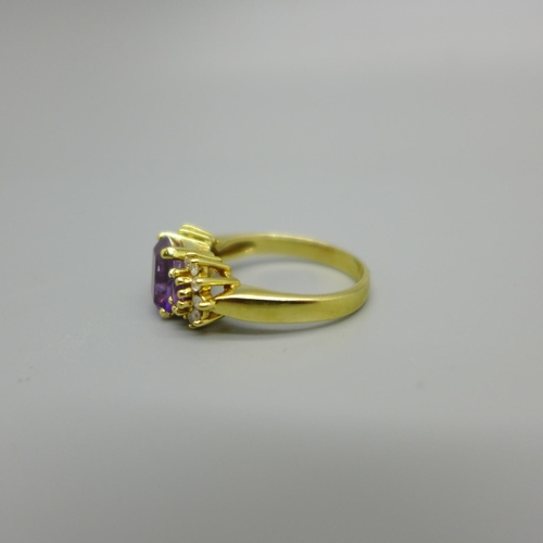 954 - An 18ct gold, amethyst and diamond ring, 4.9g, N