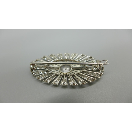 955 - An Art Deco diamond brooch, set with 126 diamonds, Millennium setting, centre stone 1ct diamond weig... 