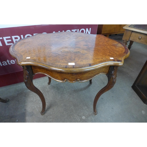 20 - A 19th Century French burr yew and rosewood serpentine centre table