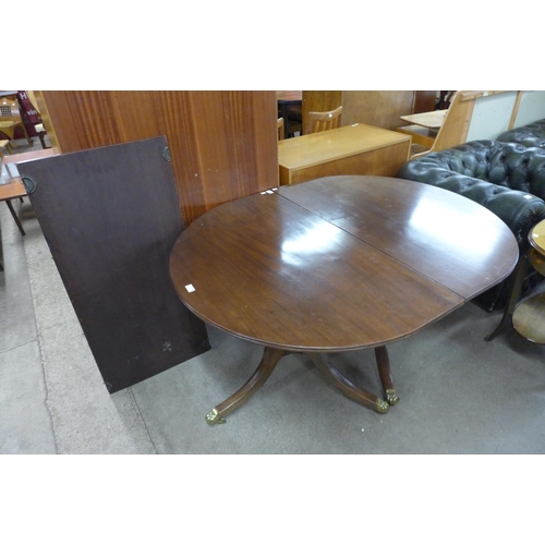 143 - A Regency style mahogany pedestal dining table