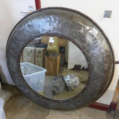 397 - A large industrial style steel framed circular mirror