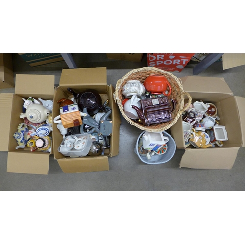 1212 - Five boxes of novelty teapots including piano, elephant, clown, school fete, Bellhop, cats, blue and... 