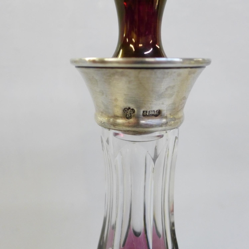 605 - A ruby flash cut crystal decanter with silver top