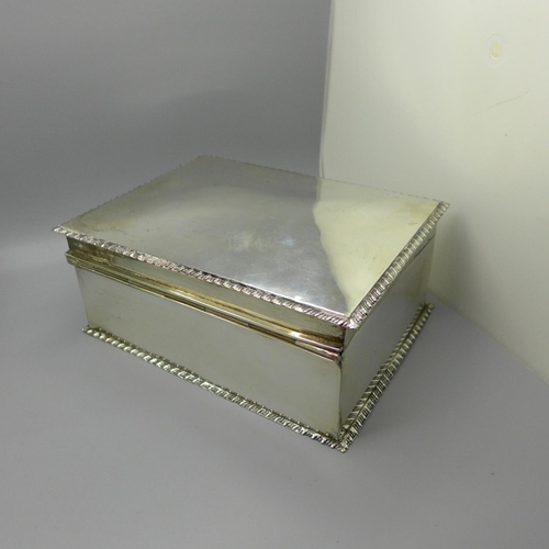 612 - A silver plated tea caddy and cannister and a plated box