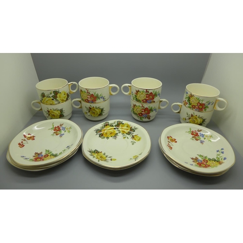 630 - Eight Brexton Pottery cups and saucers decorated with flowers