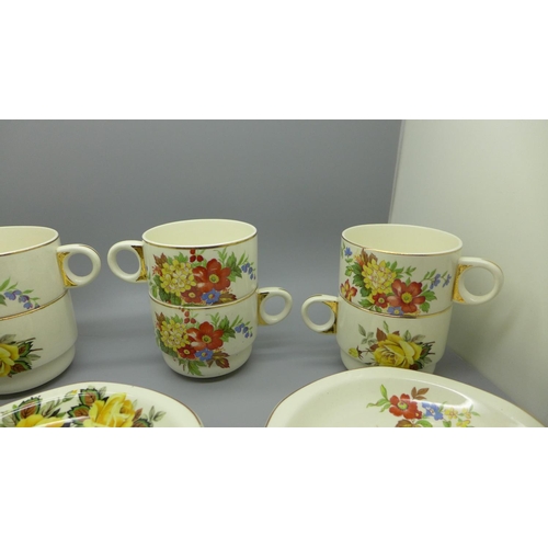 630 - Eight Brexton Pottery cups and saucers decorated with flowers