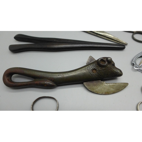 634 - A bag of mixed scissors, 19th and 20th Century, a can opener and glove stretchers