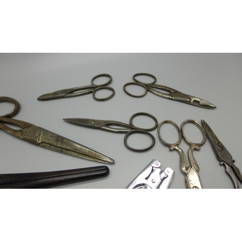 634 - A bag of mixed scissors, 19th and 20th Century, a can opener and glove stretchers