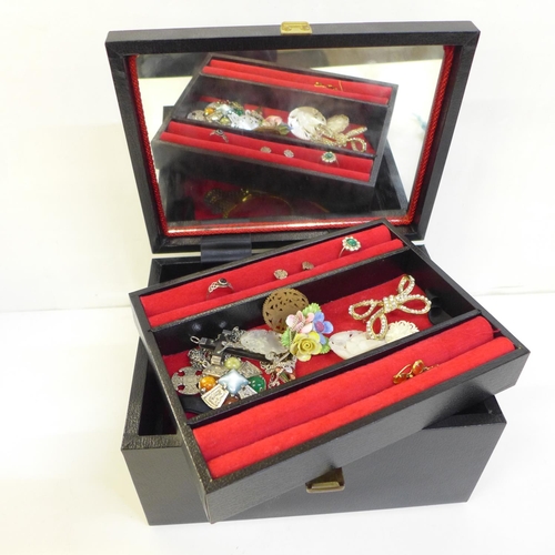 683 - A collection of costume jewellery including brooches and wristwatches in a jewellery box