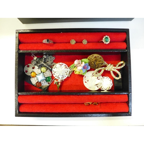 683 - A collection of costume jewellery including brooches and wristwatches in a jewellery box