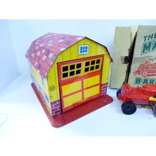 686 - A Marx tin-plate The Magic Barn and Plastic Tractor, boxed