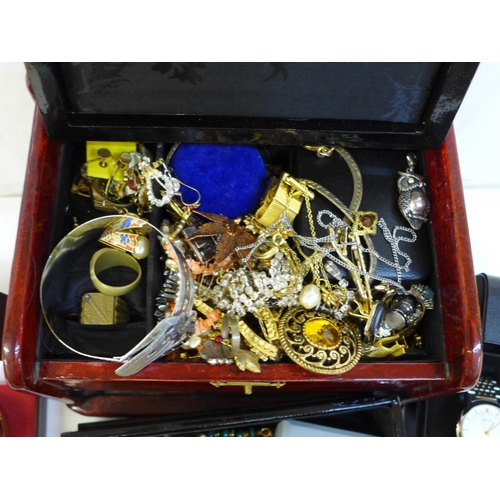 704 - A jewellery cabinet with costume jewellery and two boxed wristwatches, Rotary and Avia