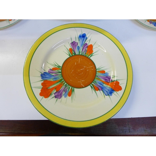 705 - Four Clarice Cliff Crocus pattern plates, a meat plate and tureen