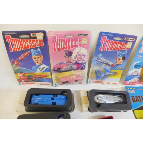 715 - A collection of Matchbox Thunderbirds vehicles, packaged and other boxed die-cast vehicles