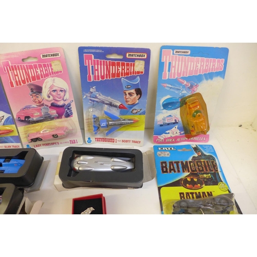 715 - A collection of Matchbox Thunderbirds vehicles, packaged and other boxed die-cast vehicles