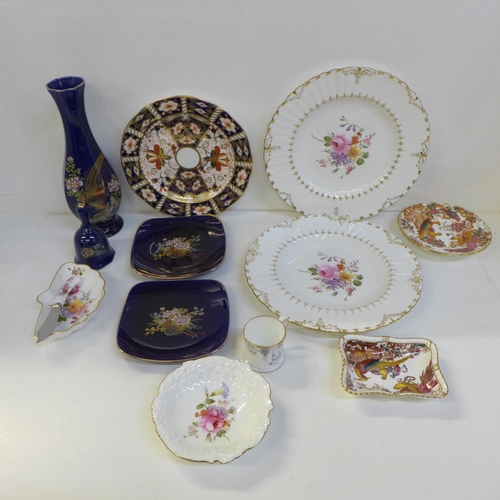 716 - A collection of Royal Crown Derby including three side plates, four dishes, a miniature mug, etc. an... 