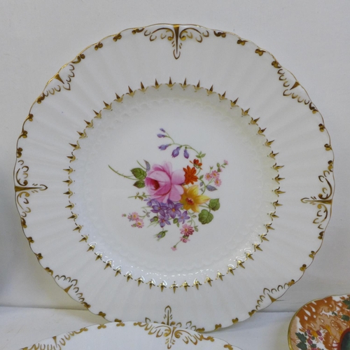 716 - A collection of Royal Crown Derby including three side plates, four dishes, a miniature mug, etc. an... 