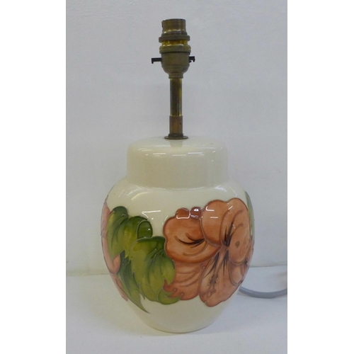 727 - A Moorcroft Hibiscus table lamp base, 20.5cm