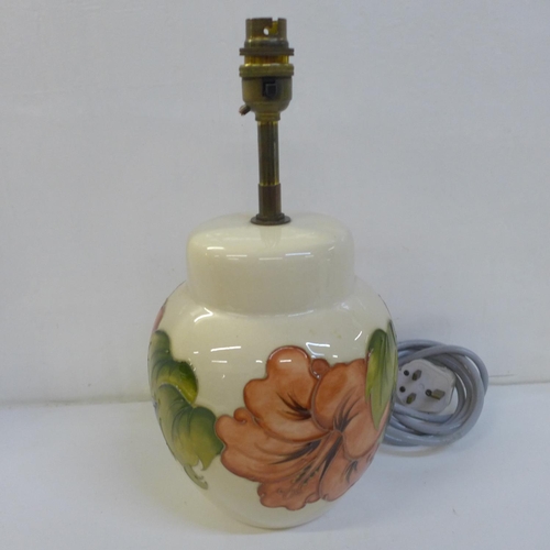 727 - A Moorcroft Hibiscus table lamp base, 20.5cm