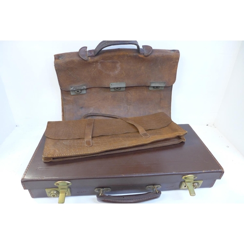 733 - A leather case with Masonic regalia, one other leather satchel and bag