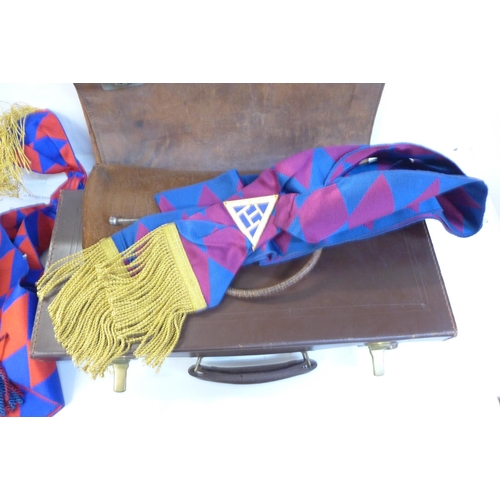 733 - A leather case with Masonic regalia, one other leather satchel and bag