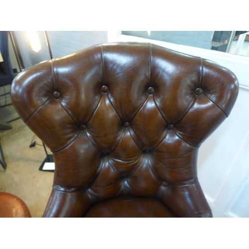 1340 - A pair of leather buttoned side chairs