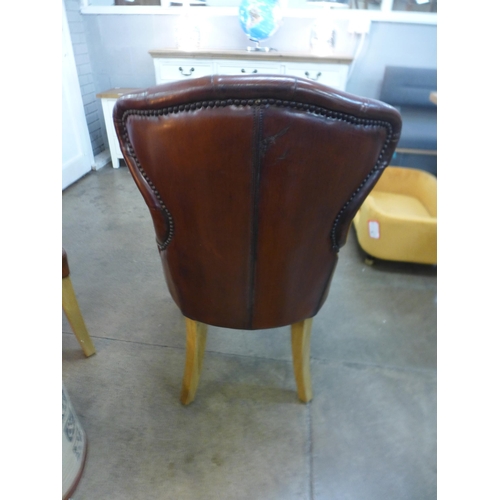 1340 - A pair of leather buttoned side chairs