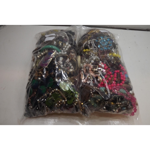 2121 - 2 Bags of costume jewellery - approx 300-350 pcs