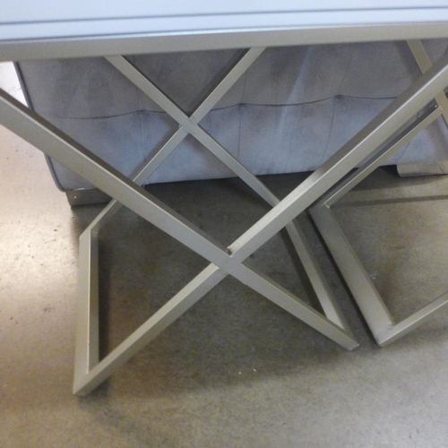 1309 - A white bedside table with crossed legs