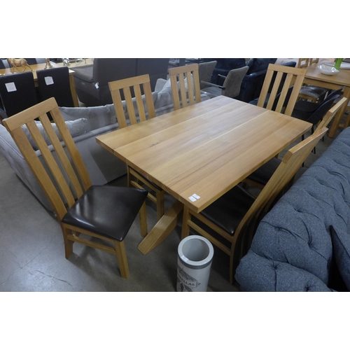 1469 - An oak fixed top dining table and six chairs