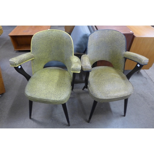 102 - A pair of Italian ebonised and vinyl armchairs