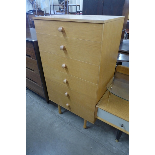 107 - A teak chest of drawers