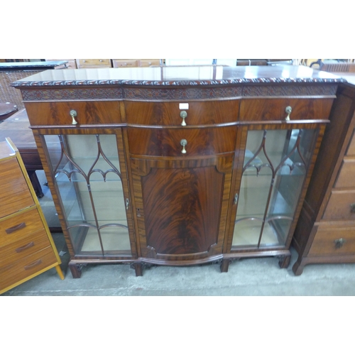 112 - An Edward VII carved mahogany bow front side cabinet