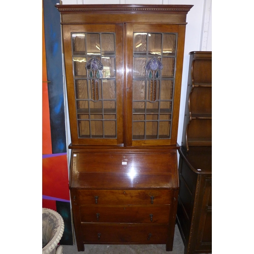 120 - An Arts and Crafts walnut bureau bookcase