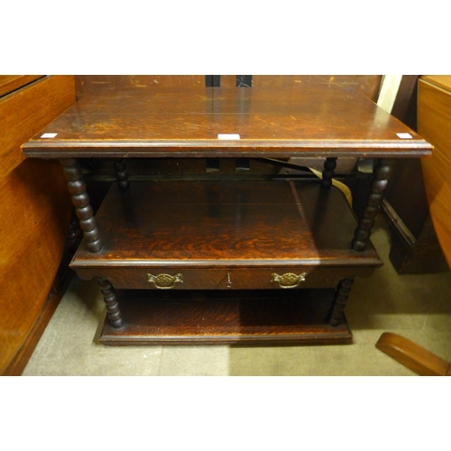 128 - An early 20th Century oak three tier buffet