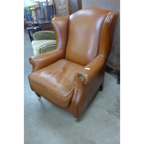 137 - A Laura Ashley brown leather wingback armchair