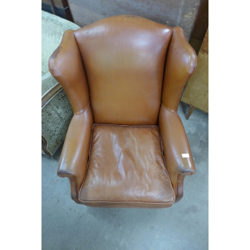 137 - A Laura Ashley brown leather wingback armchair