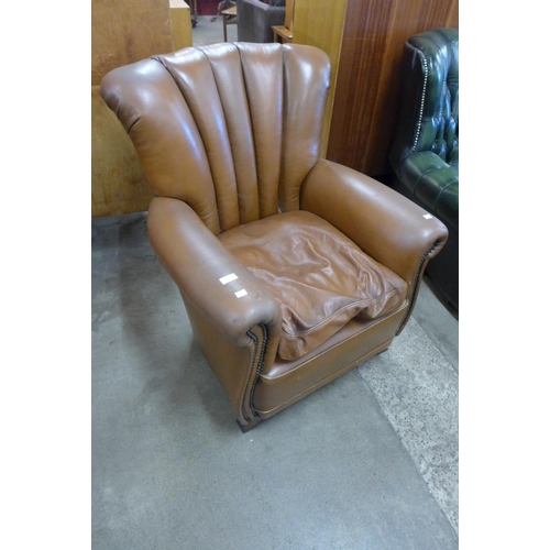 138 - A brown leather armchair