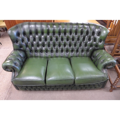 139 - A Chesterfield green leather wingback settee