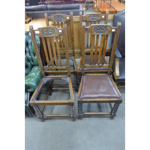 140 - A set of four oak dining chairs