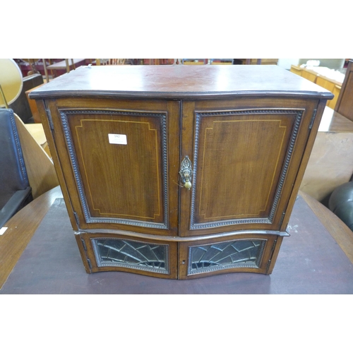 142 - An Edward VII inlaid mahogany table top cabinet