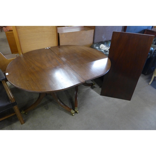 143 - A Regency style mahogany pedestal dining table