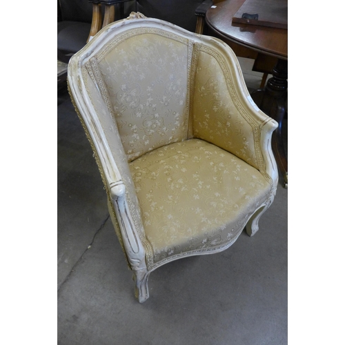 144 - A French painted and fabric upholstered fauteuil