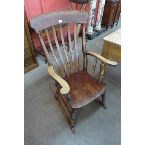 19 - A Victorian elm and beech farmhouse rocking chair