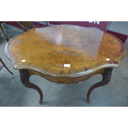 20 - A 19th Century French burr yew and rosewood serpentine centre table