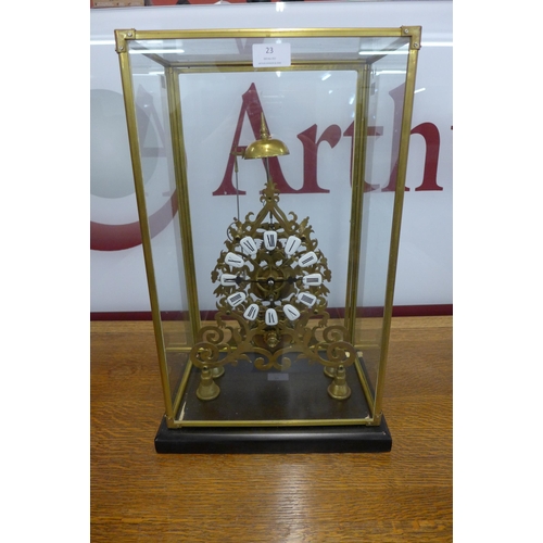 23 - A brass skeleton clock