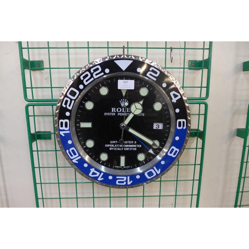 367 - A Rolex style dealer's circular wall clock