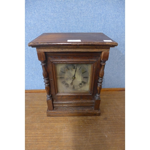 377 - A 19th Century German carved oak mantel clock