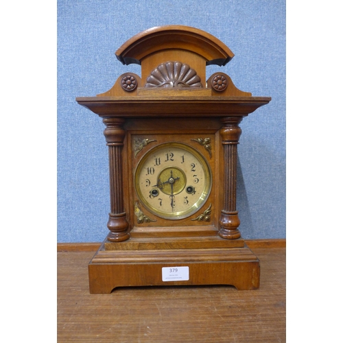 379 - A 19th Century German carved oak mantel clock